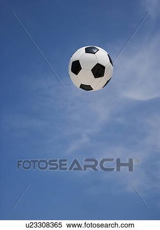 Stock Photography - Soccer ball in air. Fotosearch