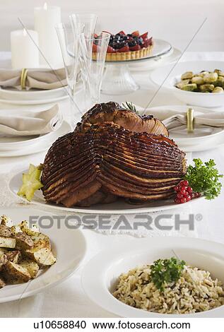 Spiral ham and side dishes on set table View Large Photo Image Stock Image - Spiral ham and side dishes on set table. Fotosearch