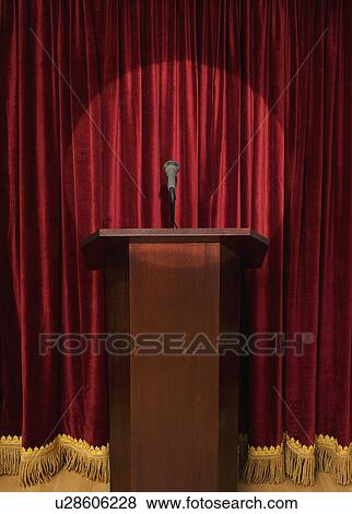 Spotlight on podium on stage View Large Photo Image Stock Photo - Spotlight on podium on stage. Fotosearch