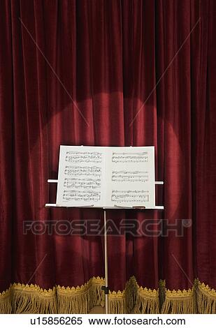 Spotlight on sheet music on stage View Large Photo Image Stock Photography - Spotlight on sheet music on stage. Fotosearch