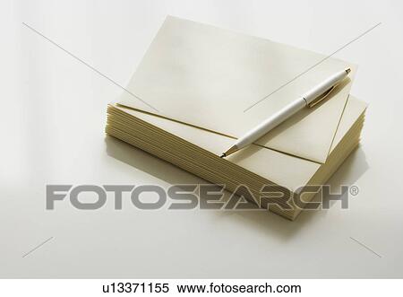 Stack of note paper and pen View Large Photo Image Stock Photography - Stack of note paper and pen. Fotosearch