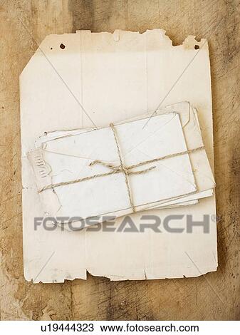 Stack of old letters on piece of paper View Large Photo Image Stock Image - Stack of old letters on piece of paper. Fotosearch