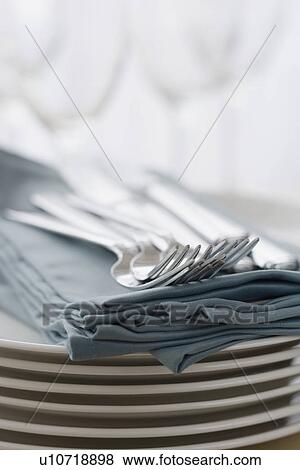 Stack of plates, silverware and napkins View Large Photo Image Stock Photo - Stack of plates, silverware and napkins. Fotosearch