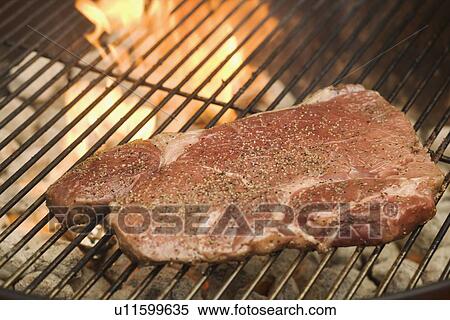 Steak cooking on grill View Large Photo Image Stock Photography - Steak cooking on grill. Fotosearch
