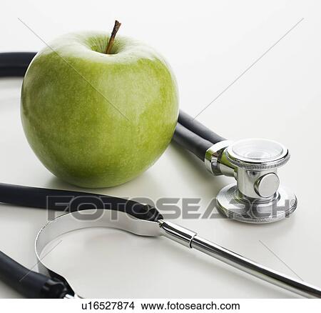 Picture - Studio shot of apple and stethoscope. Fotosearch