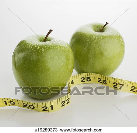 Studio shot of apples and tape measure View Large Photo Image Stock Image - Studio shot of apples and tape measure. Fotosearch