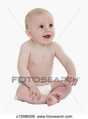 Stock Photograph - Studio shot of baby in diaper. Fotosearch