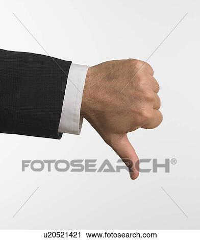 Studio shot of businessman's hand giving thumbs down View Large Photo Image Stock Image - Studio shot of businessman's hand giving thumbs down. Fotosearch