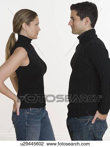 Studio shot of couple with hands in back pockets View Large Photo Image Stock Image - Studio shot of couple with hands in back pockets. Fotosearch