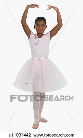 Studio shot of girl practicing ballet View Large Photo Image Stock Image - Studio shot of girl practicing ballet. Fotosearch