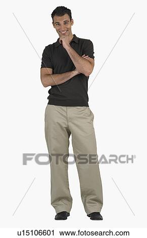 Studio shot of man smiling View Large Photo Image Stock Image - Studio shot of man smiling. Fotosearch