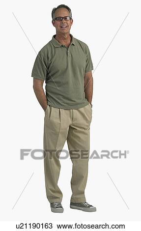 Studio shot of man with hands in pockets View Large Photo Image Stock Image - Studio shot of man with hands in pockets. Fotosearch