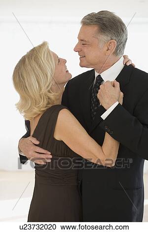 Studio shot of senior couple dancing View Large Photo Image Stock Image - Studio shot of senior couple dancing. Fotosearch