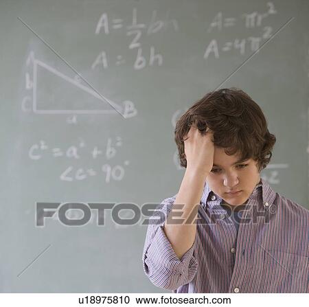 Teenaged boy in front of blackboard with math equations View Large Photo Image Stock Image - Teenaged boy in front of blackboard with math equations. Fotosearch