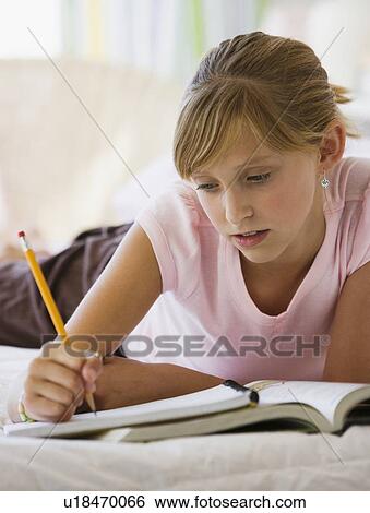 Teenaged girl doing homework View Large Photo Image Stock Photograph - Teenaged girl doing homework. Fotosearch