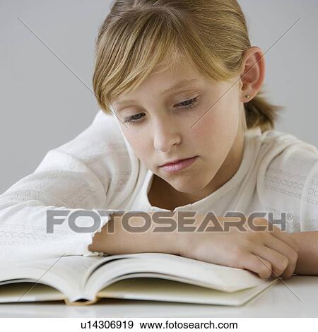 Stock Photo - Teenaged girl reading. Fotosearch