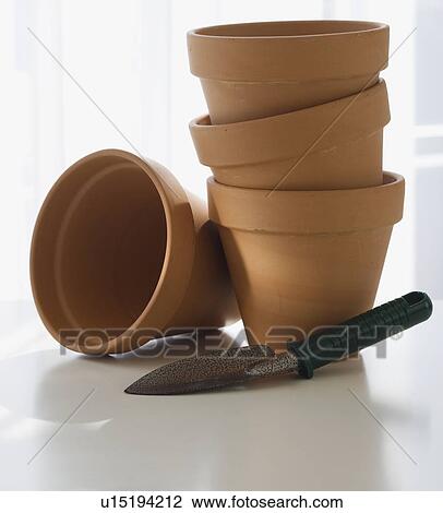 Terracotta pots and garden spade View Large Photo Image Stock Image - Terracotta pots and garden spade. Fotosearch