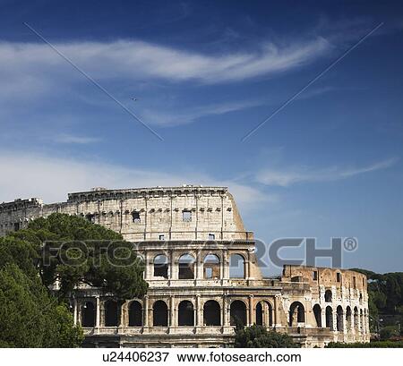 Stock Photo - The Colosseum under blue sky, Italy. Fotosearch
