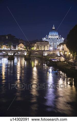Stock Image - The Tiber River with St. Peter’s Basilica at night, Italy . Fotosearch