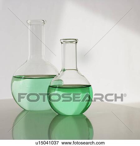 Two beakers with liquid View Large Photo Image Stock Photo - Two beakers with liquid. Fotosearch
