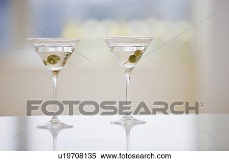 Two martinis on table View Large Photo Image Stock Photography - Two martinis on table. Fotosearch