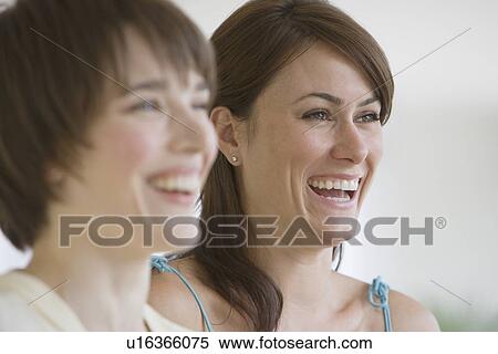 Two women laughing View Large Photo Image Stock Photography - Two women laughing. Fotosearch