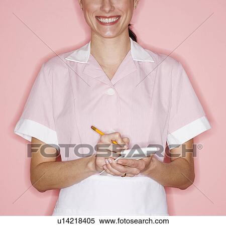 Waitress writing order on pad View Large Photo Image Stock Photography - Waitress writing order on pad. Fotosearch