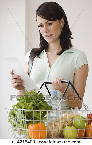 Stock Image - Woman grocery shopping. Fotosearch