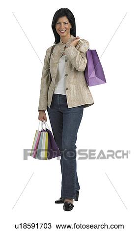 Stock Image - Woman holding shopping bags. Fotosearch