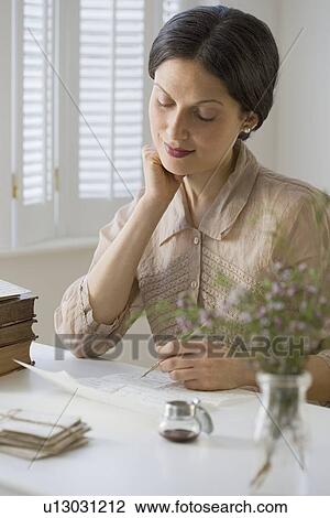 Woman in vintage clothing writing letter View Large Photo Image Stock Image - Woman in vintage clothing writing letter. Fotosearch