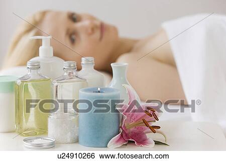 Woman laying on spa table View Large Photo Image Stock Photograph - Woman laying on spa table. Fotosearch