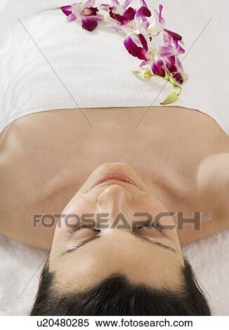 Woman laying on spa table View Large Photo Image Stock Photography - Woman laying on spa table. Fotosearch