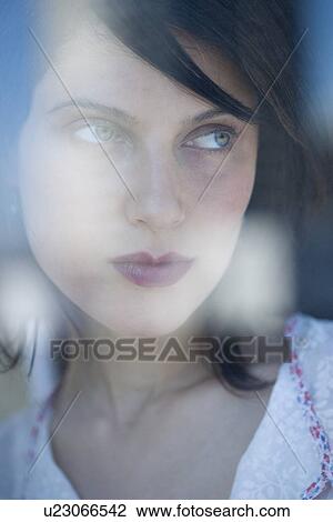 Woman looking out window View Large Photo Image Stock Image - Woman looking out window. Fotosearch