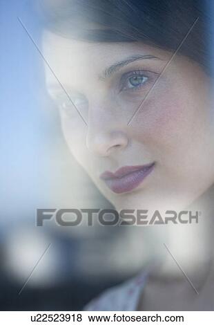Stock Photo - Woman looking out window. Fotosearch