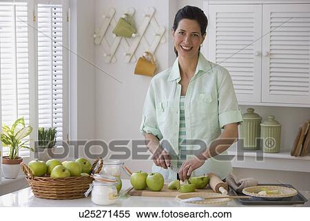 Woman making apple pie View Large Photo Image Stock Photography - Woman making apple pie. Fotosearch