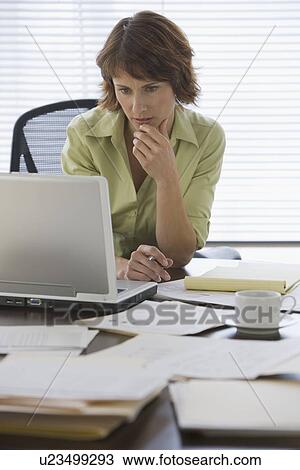 Woman paying bills online View Large Photo Image Stock Image - Woman paying bills online. Fotosearch