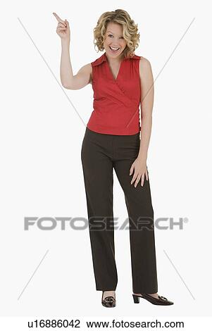 Stock Image - Woman pointing finger in air. Fotosearch