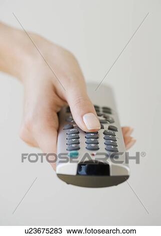 Woman pointing remote control View Large Photo Image Stock Image - Woman pointing remote control. Fotosearch