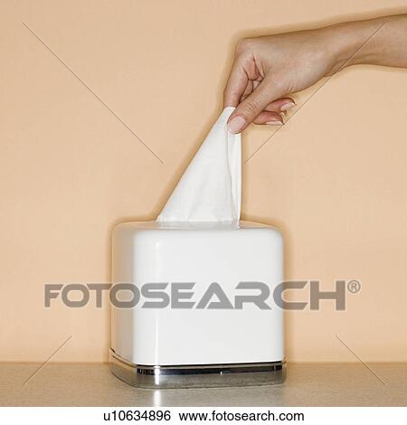 Stock Photograph - Woman pulling tissue out of box. Fotosearch
