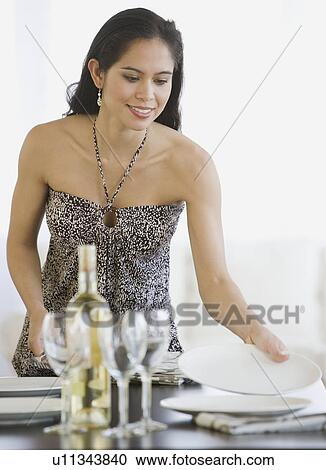 Woman setting table View Large Photo Image Stock Image - Woman setting table. Fotosearch