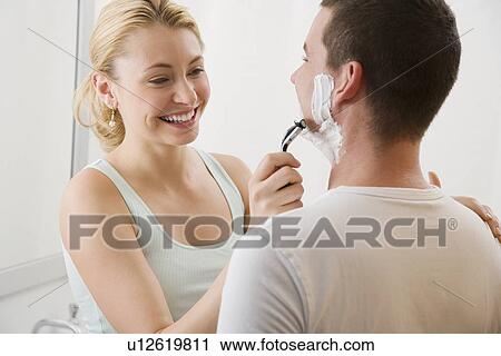 Woman shaving boyfriend’s face View Large Photo Image Stock Image - Woman shaving boyfriend’s face. Fotosearch