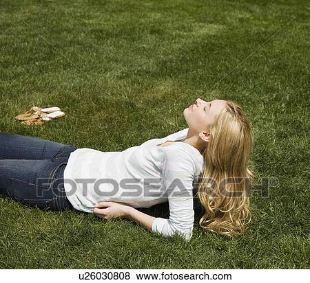 Woman sitting in sunlight View Large Photo Image Stock Photo - Woman sitting in sunlight. Fotosearch