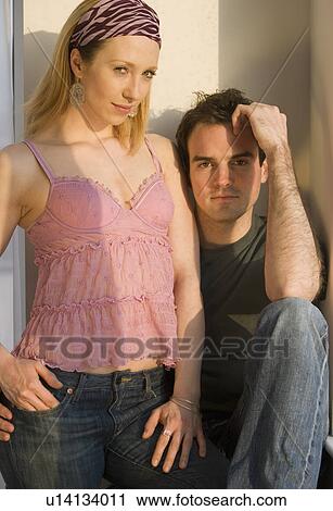 Woman standing next to boyfriend View Large Photo Image Stock Image - Woman standing next to boyfriend. Fotosearch
