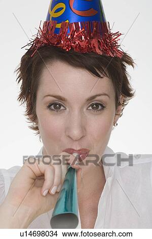 Woman wearing party hat View Large Photo Image Picture - Woman wearing party hat. Fotosearch