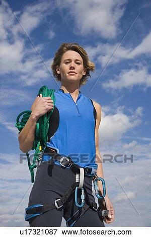Woman wearing rock climbing gear View Large Photo Image Stock Photo - Woman wearing rock climbing gear. Fotosearch