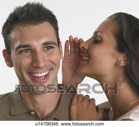 Woman whispering in man's ear View Large Photo Image Stock Photography - Woman whispering in man's ear. Fotosearch