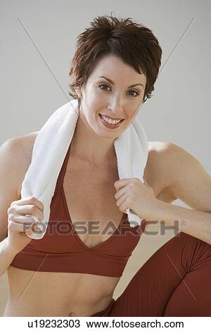 Woman with towel around neck View Large Photo Image Stock Image - Woman with towel around neck. Fotosearch