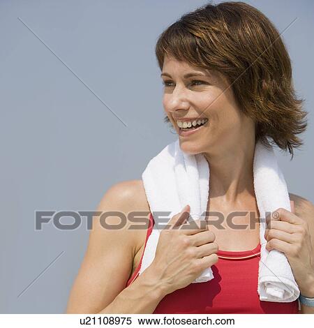 Stock Photography - Woman with towel around neck. Fotosearch
