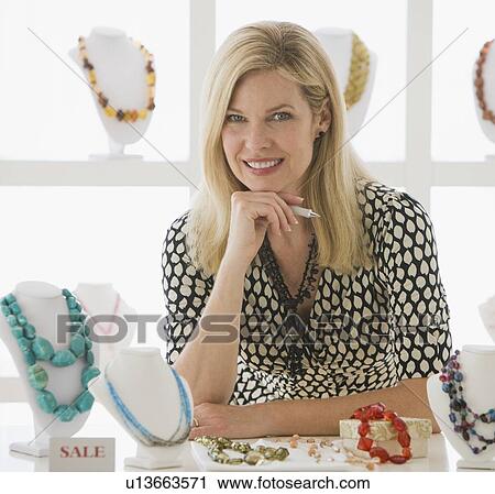 Woman working in jewelry store View Large Photo Image Stock Image - Woman working in jewelry store. Fotosearch