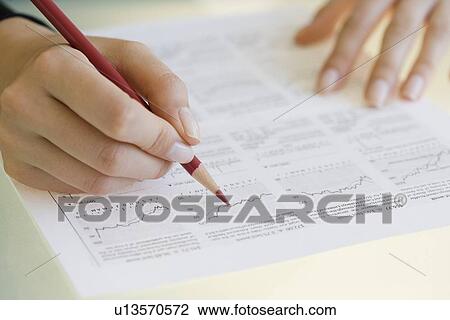 Woman writing on financial charts View Large Photo Image Stock Image - Woman writing on financial charts. Fotosearch